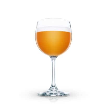 Scotch Egg-nog in a stemmed wine glass with foam on white background