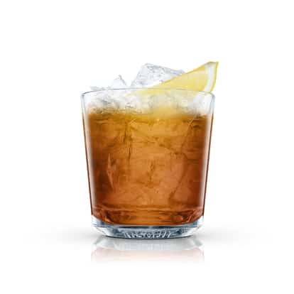 Sidney in an Absolut rocks glass with crushed ice and a lemon wedge on white background