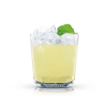South Side Fizz in an Absolut rocks glass with crushed ice and a mint leaf on white background