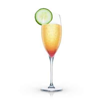 Sparkling Galliano in a champagne flute with cucumber wheel on white background