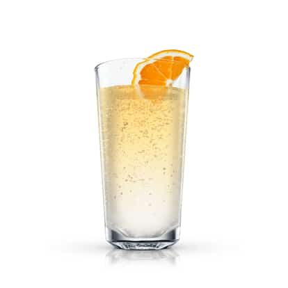 Sparkling Orange in a highball glass with an orange wedge on the rim on white background