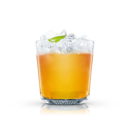 Stone Fence in an Absolut rocks glass with crushed ice and a lime leaf on white background