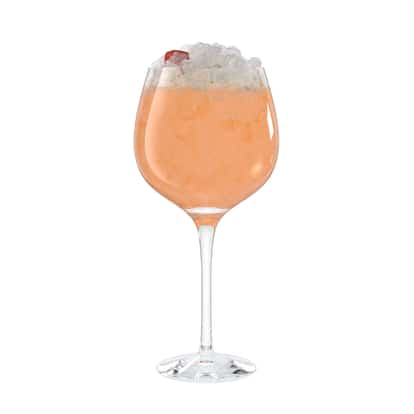 Sunny Dream served in a wine glass with crushed ice and a cherry garnish