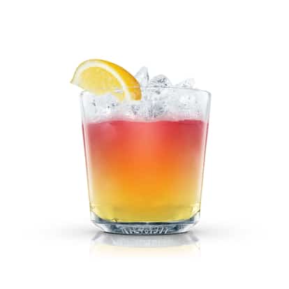Sunriser in an Absolut rocks glass with crushed ice and an orange wedge on white background