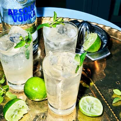 Swedish Death Nettle, a Swedish cocktail next to a bottle of Absolut Vodka