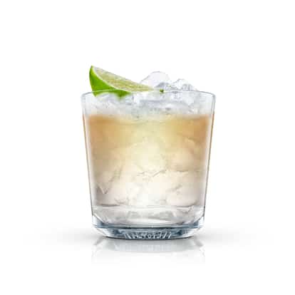 The Clover in an Absolut rocks glass with crushed ice and a lime wedge on white background