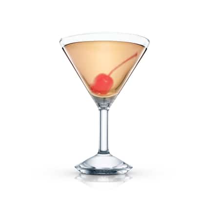 Thistle in a martini glass with a maraschino cherry on white background