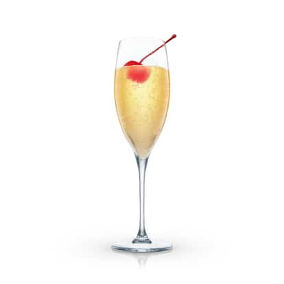 Tip Top served in a champagne flute with a maraschino cherry on white background