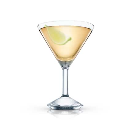 Toreador served in a martini glass garnished with a lime wedge on white background