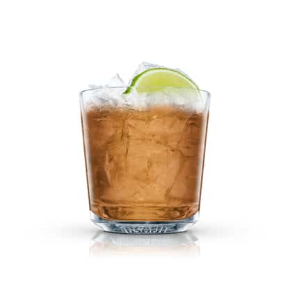 Twin Hills in an Absolut rocks glass with crushed ice and lime wedge on white background