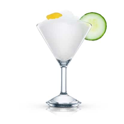 Two Inches of Cucumber in a martini glass with crushed ice, cucumber slice and lemon peel on white background
