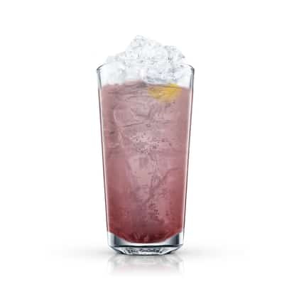 Vermouth Cassis in a tall highball glass with crushed ice and a lemon twist on white background