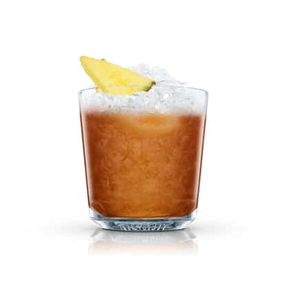 Whisky Cobbler served in an Absolut rocks glass with crushed ice and pineapple wedge on white background