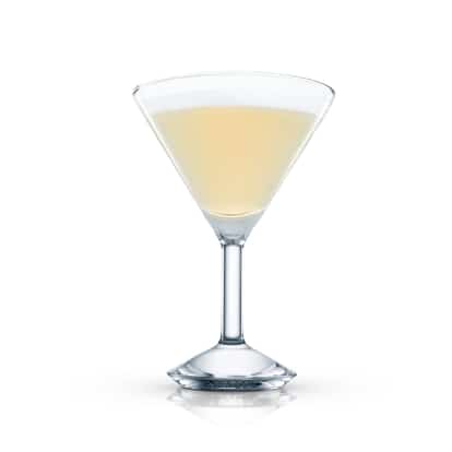 Pale yellow cocktail in a martini glass on white background.