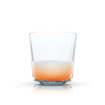 Single milk-based cocktail in an Absolut rocks glass on white background.