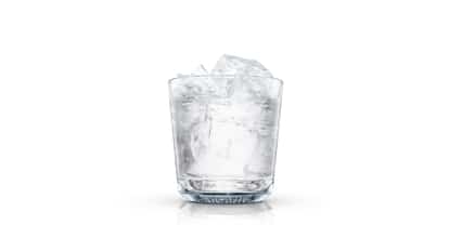 Absolut Straight served in a rocks glass filled with ice on white background.