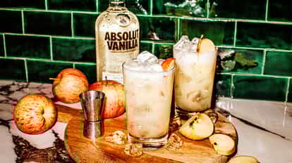 Absolut Vanilia fluffy next to a bottle of Absolut Vanilia vodka