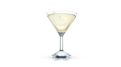 Azure Martini in a martini glass with an apple slice on white background