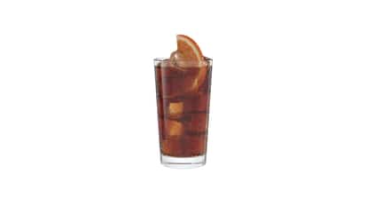 Black Orange in a highball glass with ice cubes and an orange slice on white background