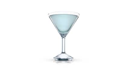 Blue Metrazur served in a martini glass on white background.