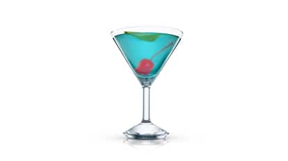 Blue Temptation cocktail in an Absolut martini glass garnished with a cherry and citrus twist on white background.
