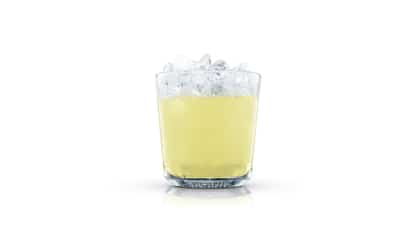 Clipper in an Absolut rocks glass with crushed ice on white background