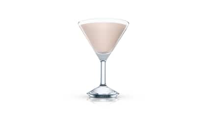 Creamsicle served in a martini glass filled to the rim on white background