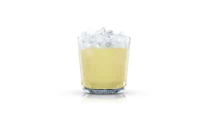 Cucumber and Rosemary Lemonade in an Absolut rocks glass with crushed ice on white background