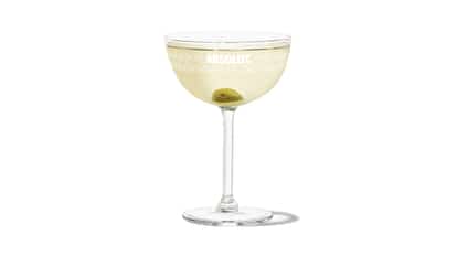 Dirty Vodka Martini in a coupe with olive garnish, Absolut logo on the glass.