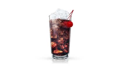 Factory Cola in a highball glass with crushed ice and a maraschino cherry on white background
