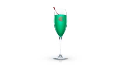 Green cocktail in a champagne flute garnished with a red cherry on white background.