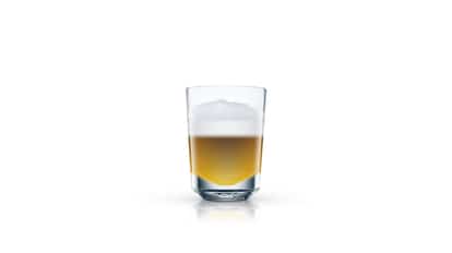Hot Shot in a short glass with foam and separated layers on white background