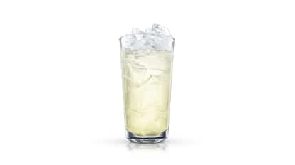 Joe Collins in a highball glass filled with crushed ice on white background