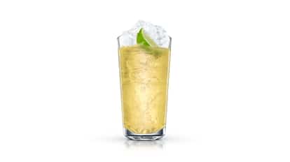 Lemonade Cooler in a highball glass with crushed ice and a lime wedge on white background