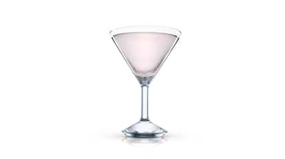 Pale pink martini in an Absolut martini glass on white background.
