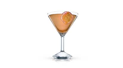 Mc Martini in a martini glass garnished with a passion fruit slice on white background