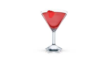 Peanut Butter & Jelly Martini in an Absolut martini glass with a raspberry on the rim on white background