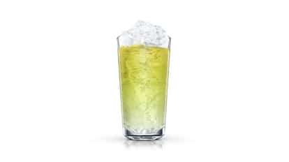 Piggelin served in a highball glass filled with crushed ice on white background