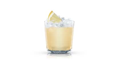 Rising Sun in an Absolut rocks glass with crushed ice and a lemon wedge