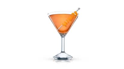 Rye Crusta in a martini glass with a spiral orange peel on a metal pick on white background