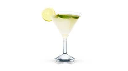 Silky grey tie in a martini glass with lemon wheel on rim and lime peel inside