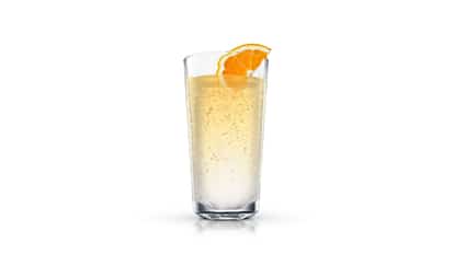 Sparkling Orange in a highball glass with an orange wedge on the rim on white background