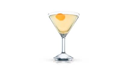 Svetlana served in a martini glass with an orange peel garnish on white background