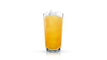 Tatanka in a highball glass with ice on white background