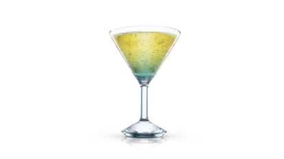 Vacation Martini layered in a single martini glass on white background