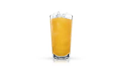 Warsaw Cooler in a tall highball glass with large ice cubes on white background.