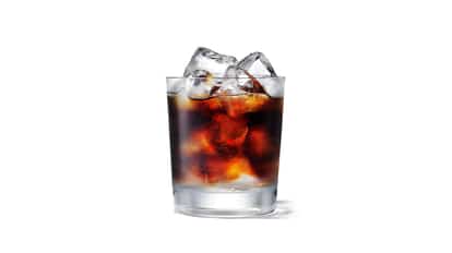 Watermelon Coffee with Gianni in a rocks glass with ice on white background