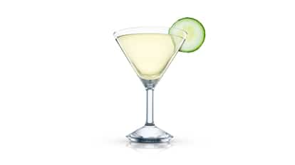 Zakuski Martini in a martini glass with a cucumber slice on white background